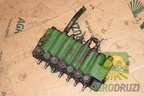 Б/В Помпа гідравліки John Deere в зборі (шків, патрубок)